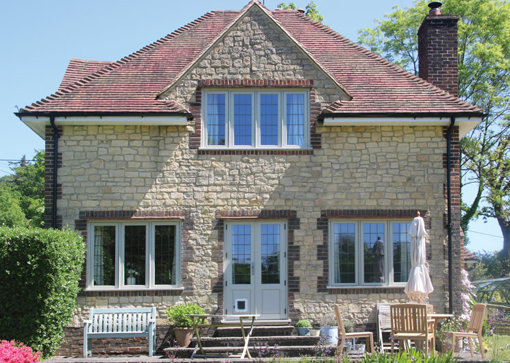 Recessed Edwardian timber casement windows in French Grey for this picturesque Country Cottage in Wormley, Surrey