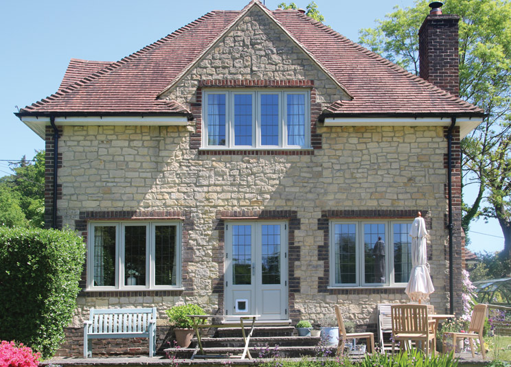 Recessed Edwardian timber casement windows in French Grey for this picturesque Country Cottage in Wormley, Surrey