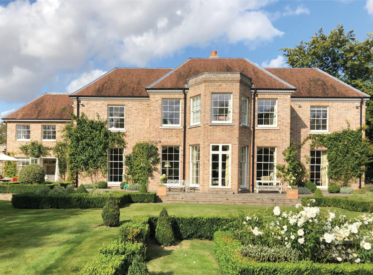 Slimline timber sash windows and French doors for the impressive Newbuild country house in Virginia Water, Surrey