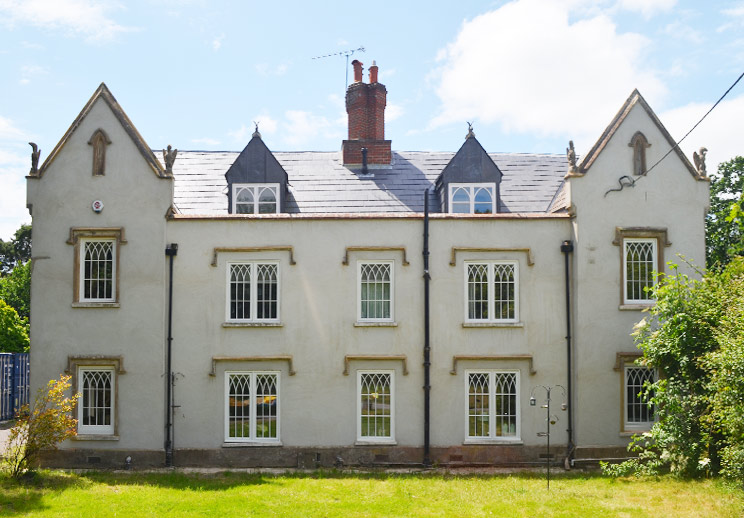 New and replacement Recessed timber casement windows with arched glazing bars for this exceptional country House in Churt, Farnham